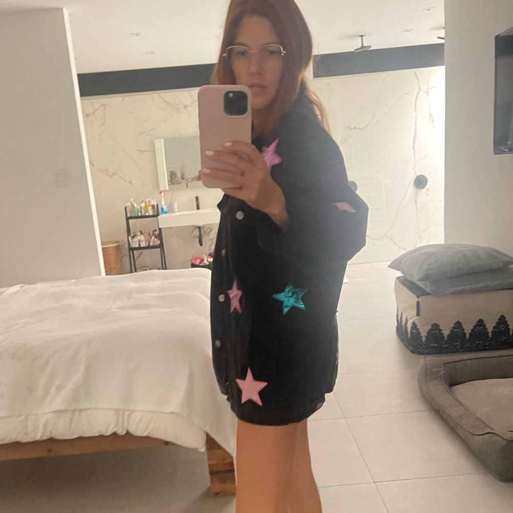 black mahon jacket with colored sequin star.
